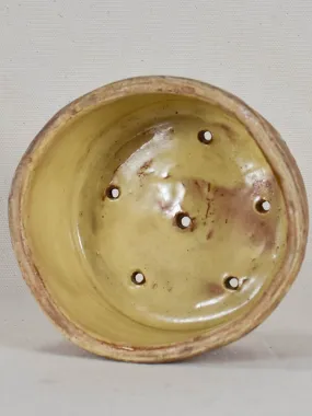 Antique French clay cheese strainer with yellow glaze